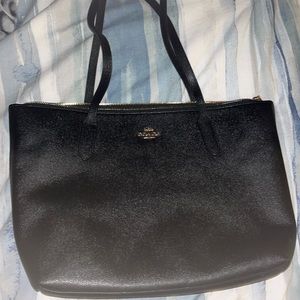 Like new Coach black zip top tote with gold accents